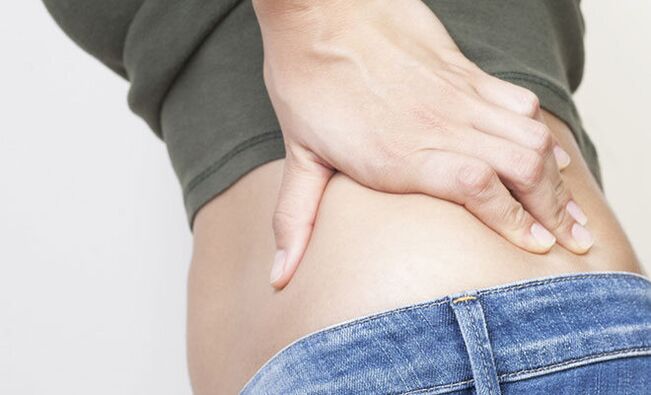 After normal hypothermia, sharp pain in the lower back may appear